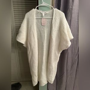 Poncho style vest. Never worn. Tag states one size fits all